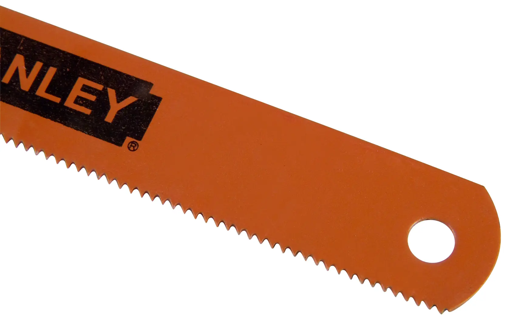 Close-up of an orange Stanley saw blade with sharp teeth and a hole at the end.