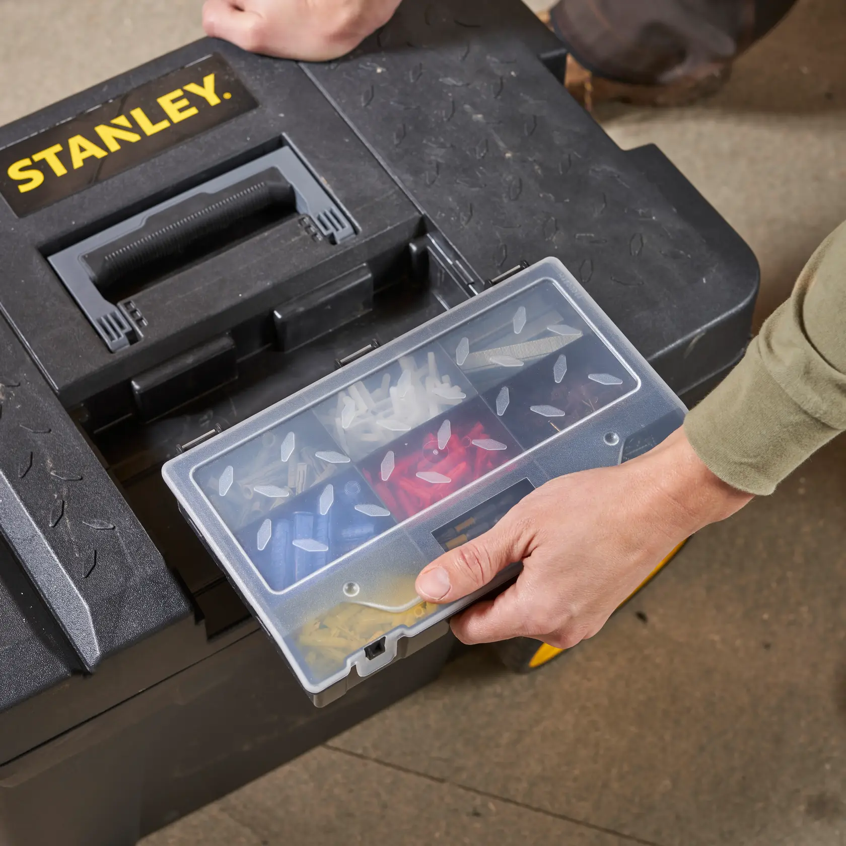 STANLEY 1-97-503 toolbox with transparent tray organizer containing assorted hardware, photo top view.