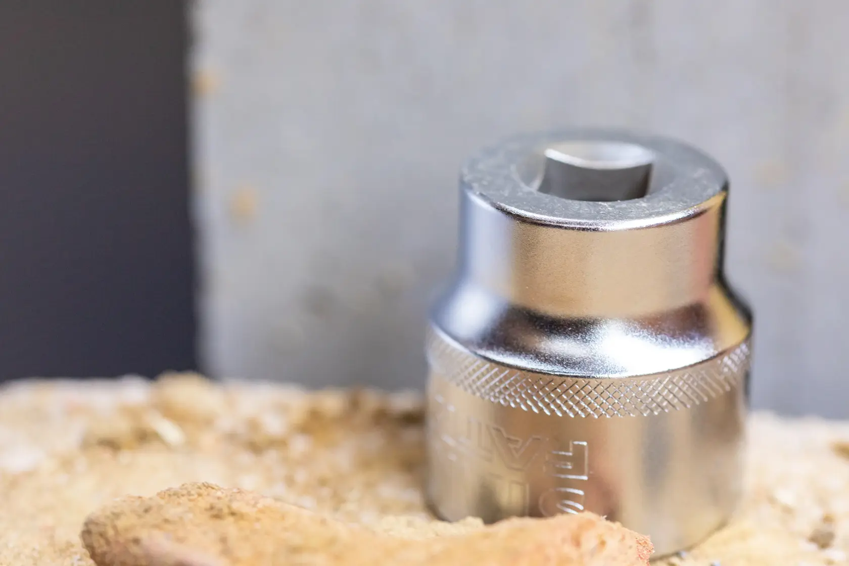 STANLEY FMMT17238-0 chrome socket tool on a sandy surface, close-up photography.
