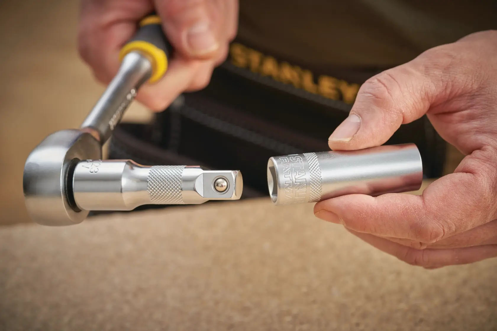 STANLEY FMMT17968-0 socket being attached to ratchet wrench in close-up photography.