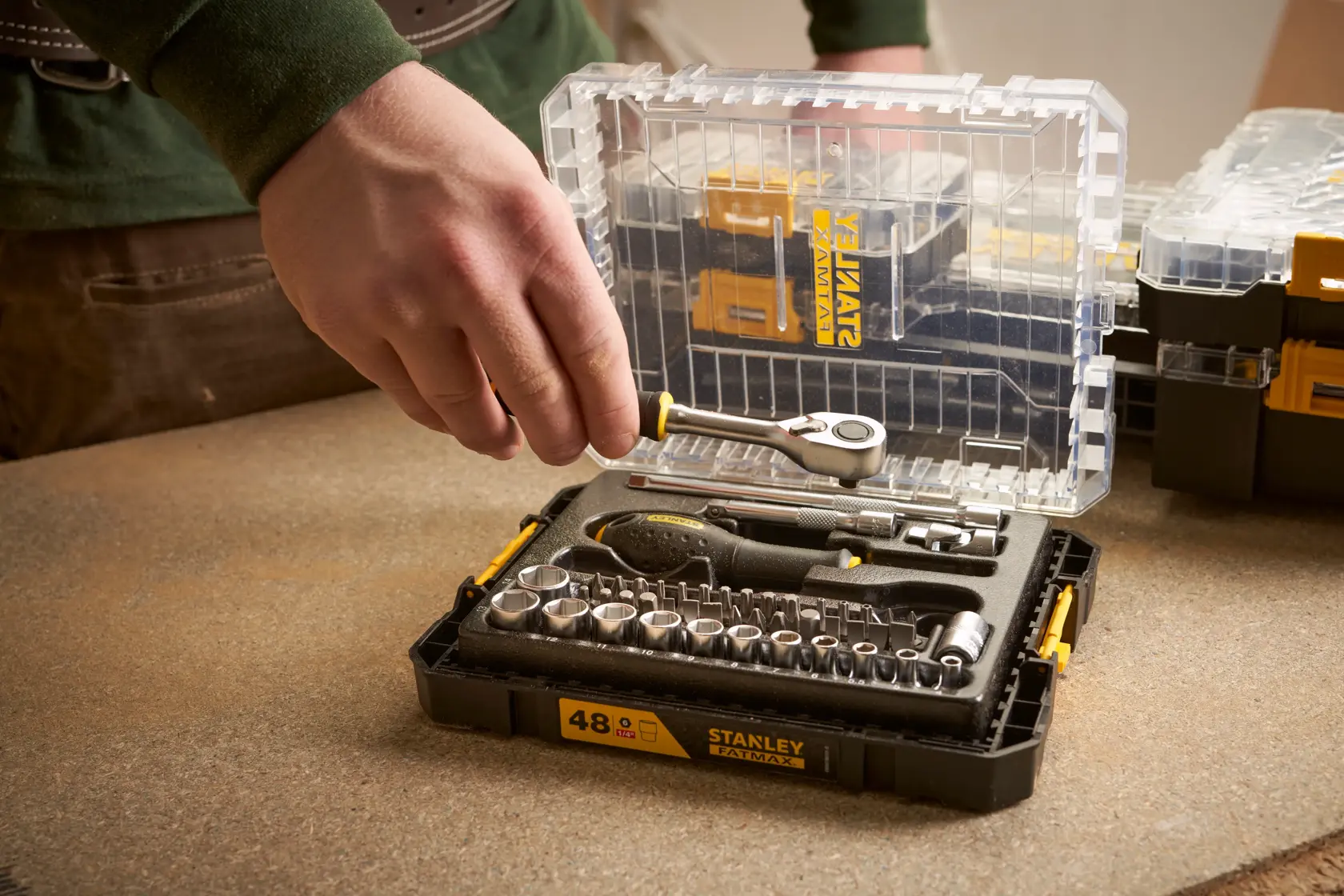 Photo of STANLEY FMMT98101-0 socket and ratchet tool set in clear plastic case on workbench.