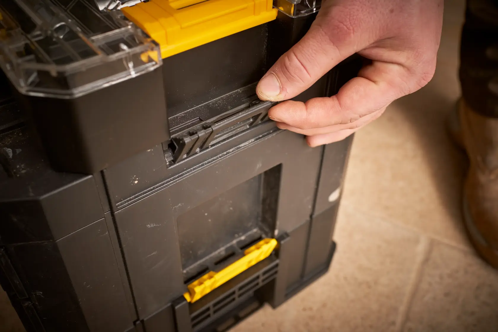 STANLEY FMMT98103-1 black and yellow toolbox, close-up of latch being secured.
