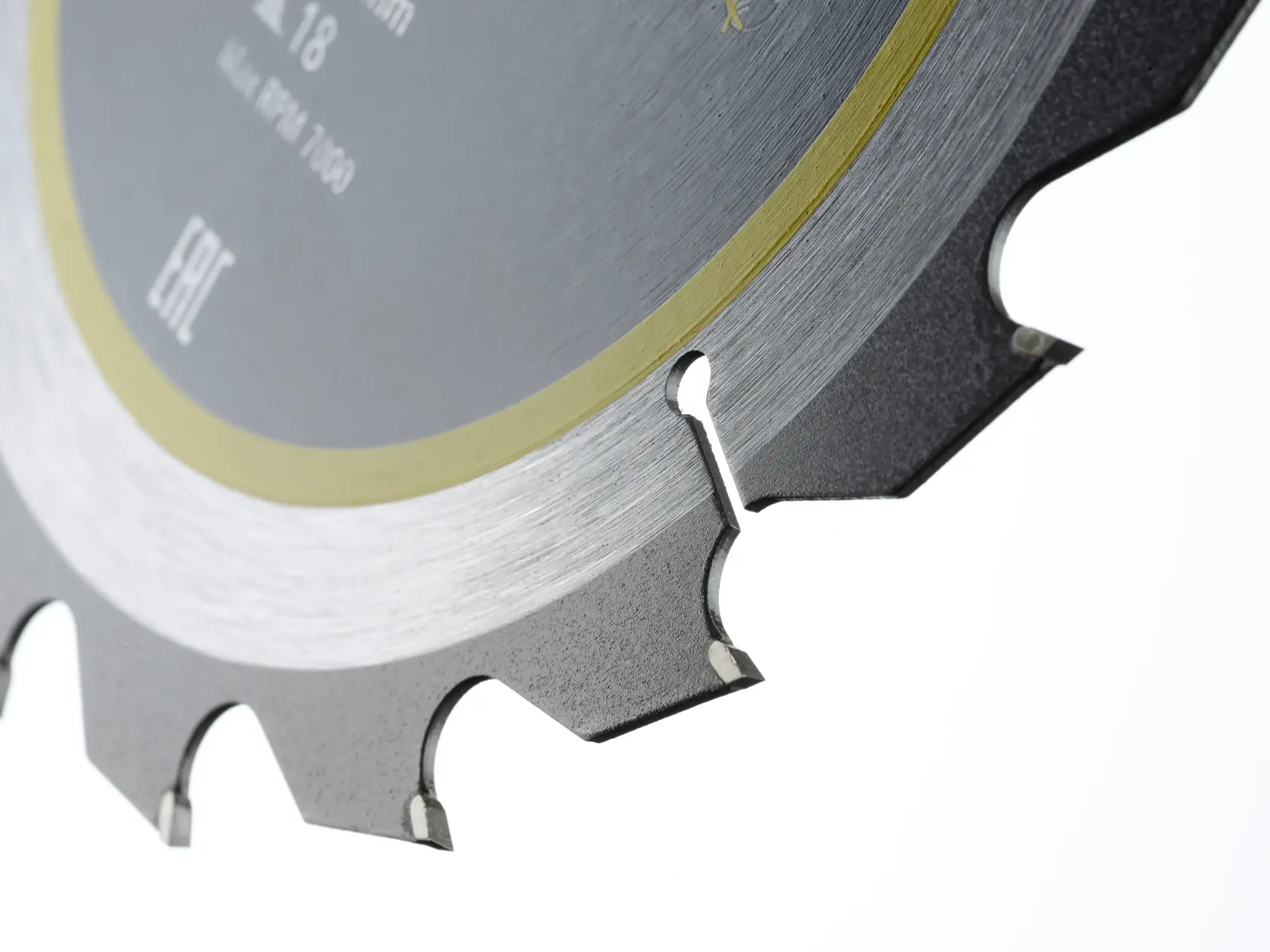 Close-up of a circular saw blade showing sharp teeth and metal surface details.