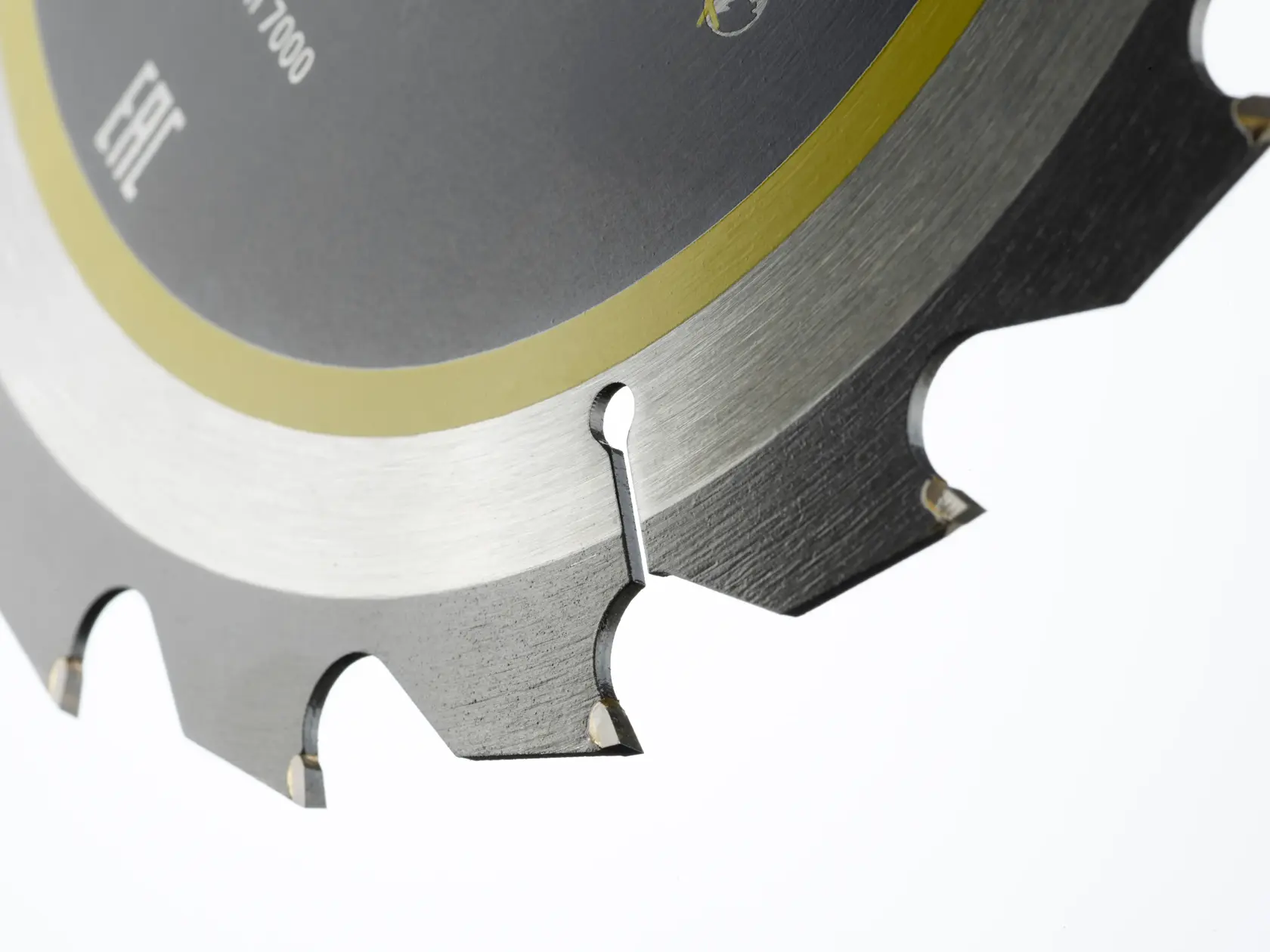 Close-up of a circular saw blade with sharp teeth and a metallic finish.
