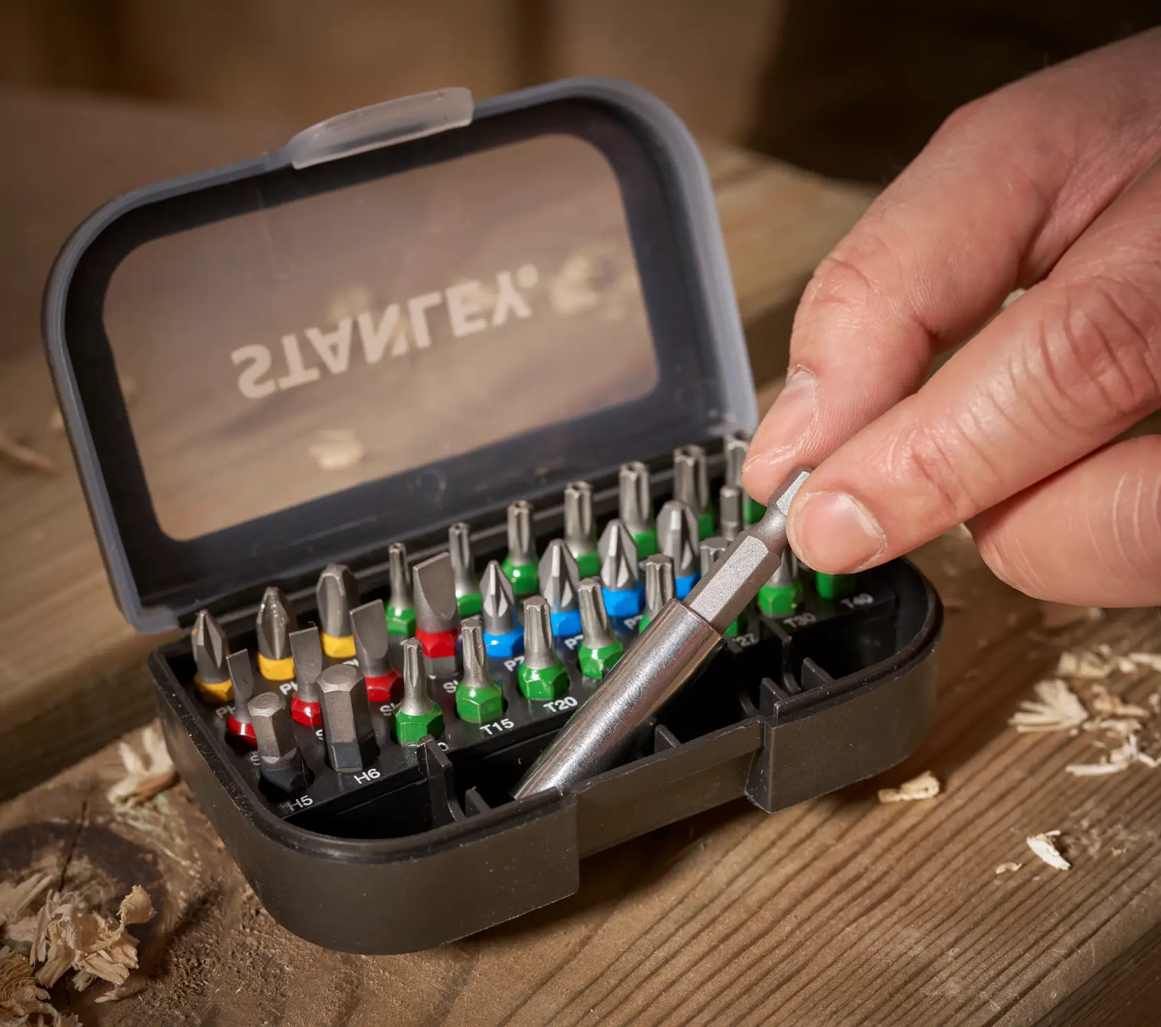STANLEY STA60490 screwdriver bit set in black case with assorted colored bits, close-up photography.