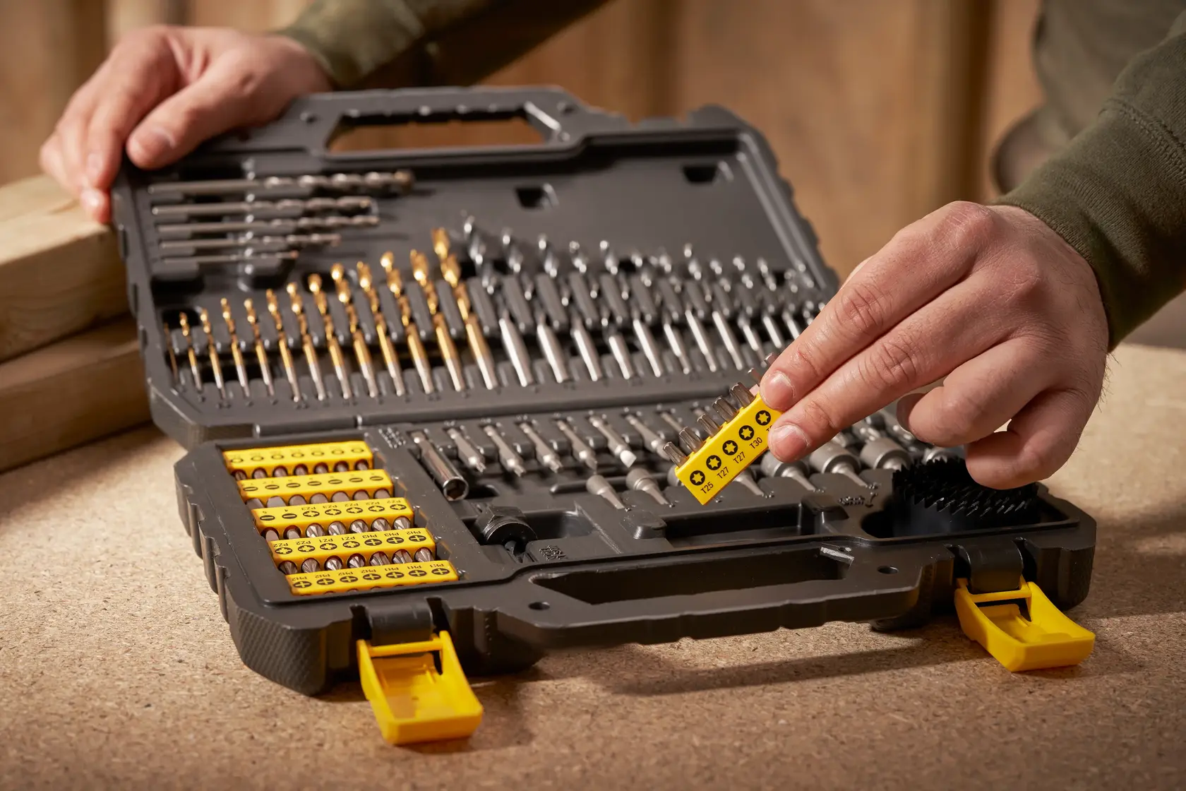STANLEY STA88548 drill and screwdriver bit set in open case, hand selecting yellow bit holder.