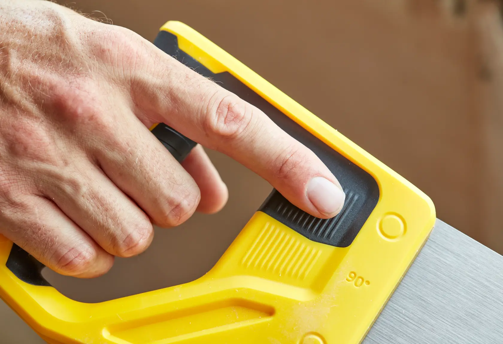 STANLEY STHT20350-1 hand saw handle detail, yellow and black plastic grip, close-up photography