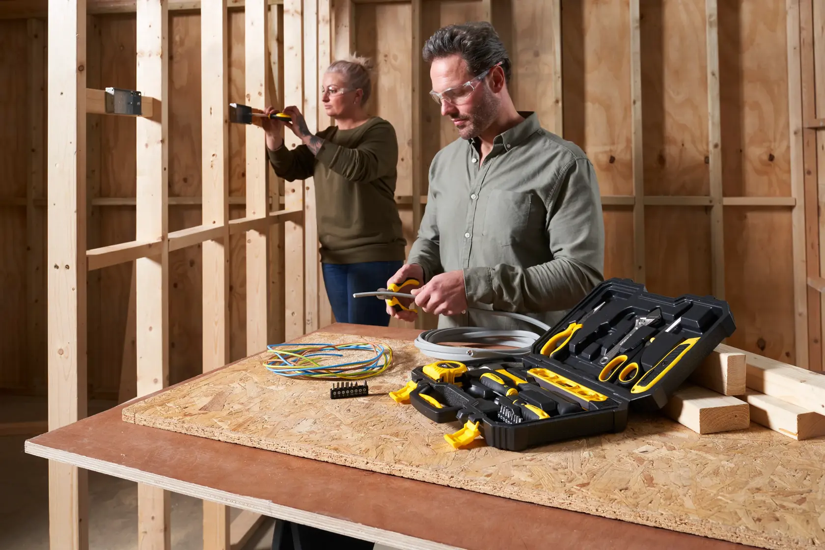 STANLEY STHT78050-1 tool kit photography with open case and tools on table, workshop setting.