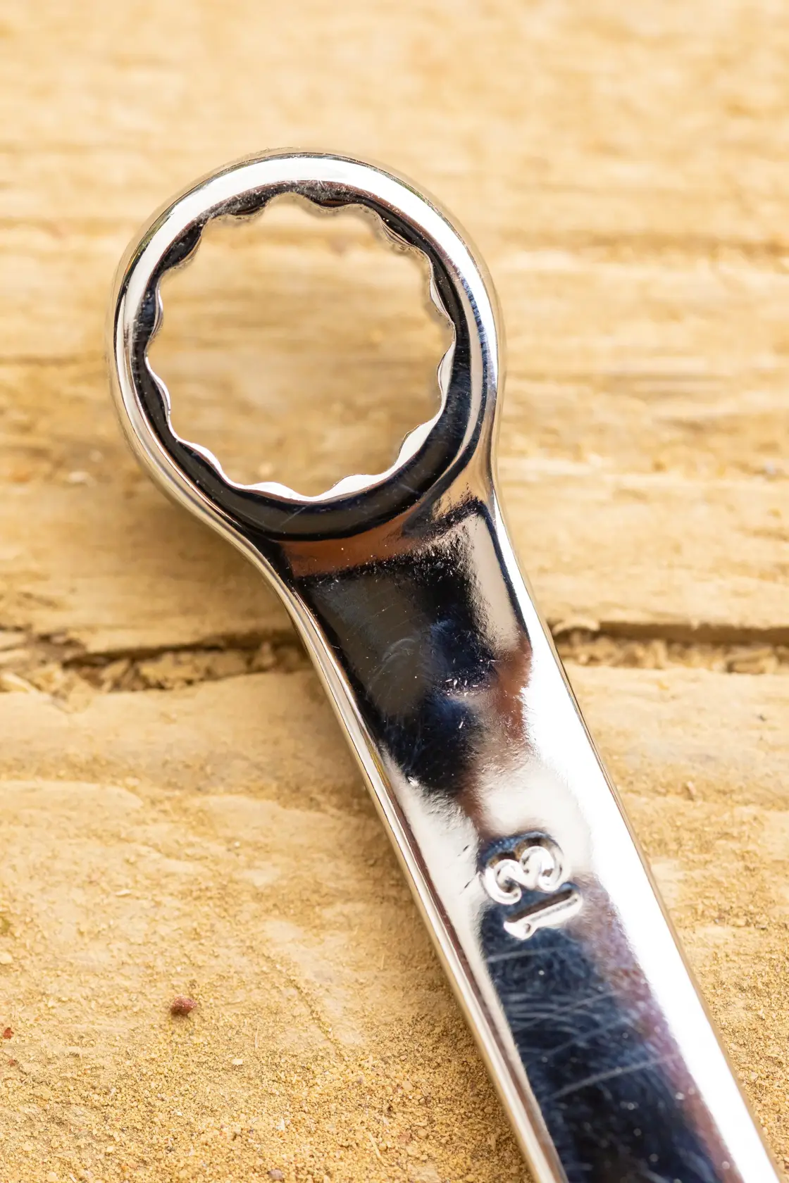 STANLEY STMT82842-0 box-end wrench close-up photography on wood surface.