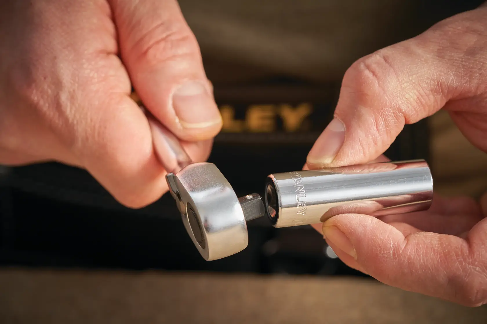 STANLEY STMT86100-0 socket and ratchet photography held in hands with visible STANLEY branding.