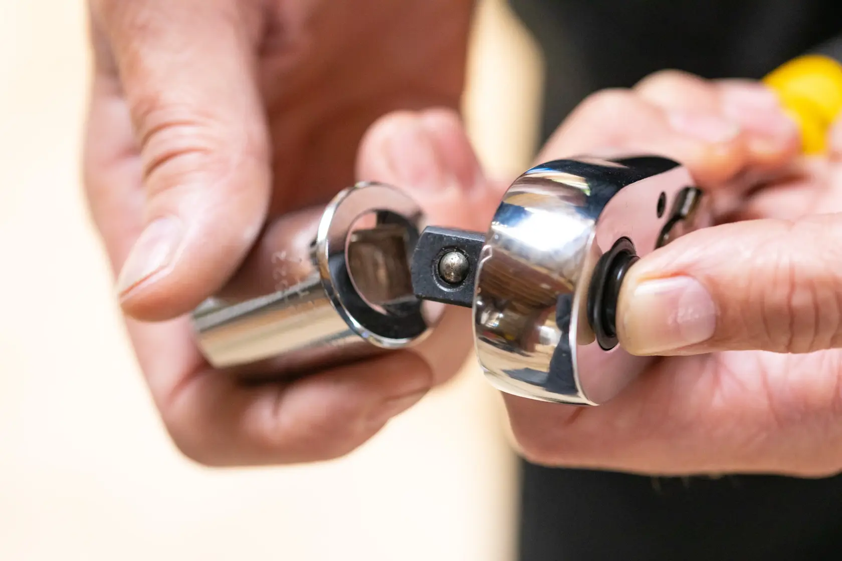 STANLEY STMT86519-0 close-up photography of chrome ratchet and socket being connected by hand.