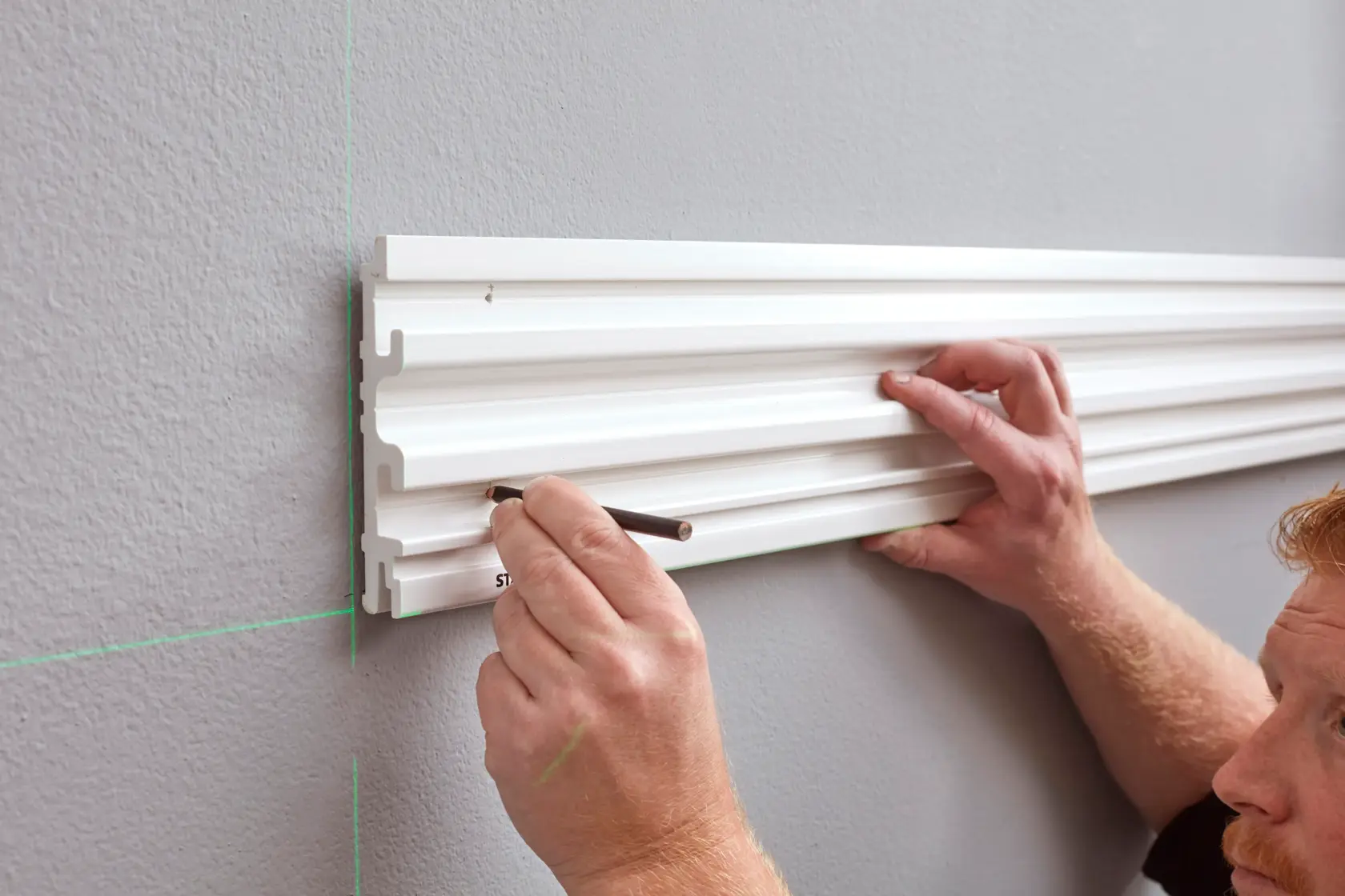 STANLEY STST82602-1 wall organizer rail, marked for installation, photography from side angle.